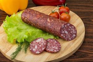 Salami on wood photo