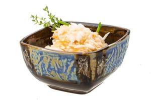 Fermented cabbage on white photo