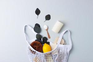 Zero waste, sustainable and eco-friendly lifestyle. Set of eco friendly natural cleaning products on grey background. Flat lay photo