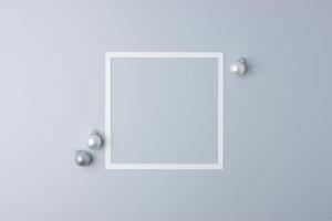 Christmas grey minimal background with white frame and grey ball. Flat lay, copy space photo