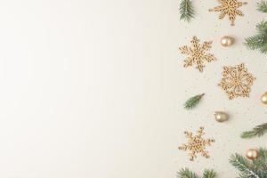 Christmas background with Christmas decorations on beige pastel. Flat lay, copy space photo