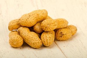 Peanut on wooden background photo