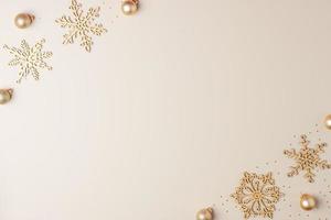 Christmas beige minimal background with snowflakes. Flat lay, copy space photo