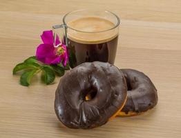 Chocolate donuts on wood photo