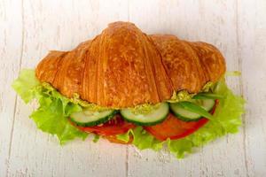 Vegan croissant on wooden background photo