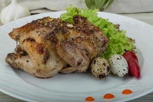 Quail grilled dish view photo