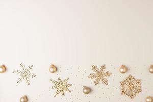 Christmas beige minimal background with snowflakes. Flat lay, copy space photo