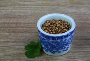 Coriander seeds dish view photo