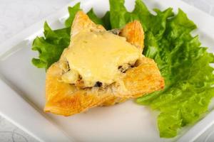 Mushroom pastry on the plate and white background photo
