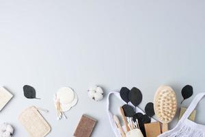 Zero waste, sustainable and eco-friendly lifestyle. Bathroom natural products from reusable materials on grey background. Flat lay, copy space photo