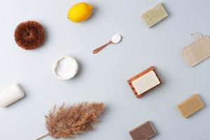 Zero waste, sustainable and eco-friendly lifestyle. Set of eco friendly natural cleaning products on grey background. Flat lay photo