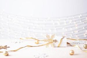 Christmas decorations with gift on white background. Close up, copy space photo