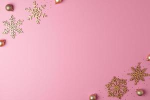 Christmas pink minimal background with snowflakes. Flat lay, copy space photo
