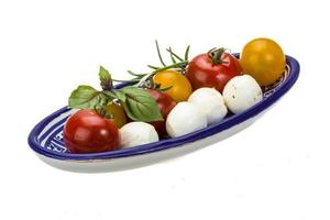 Caprese salad on white photo