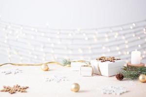 Christmas decorations with gifts on white background. Close up, copy space photo