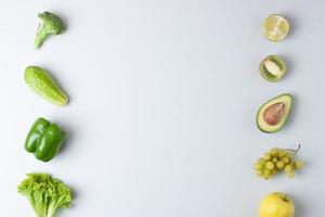 Fresh fruits and vegetables on grey background. Healthy eating concept. Flat lay, copy space. photo