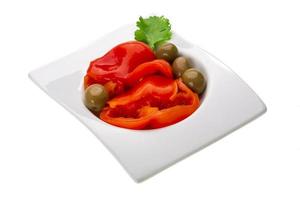 Marinated pepper on white photo