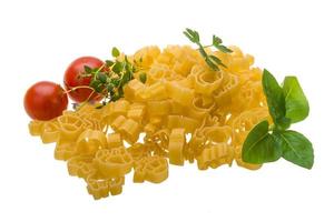 Raw macaroni on white photo