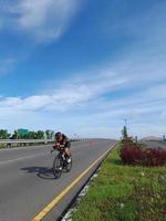 Lombok Island, Indonesia, October 8, 2022, One of the cyclists participating in the Ironman 70.3 triathlon on the island of Lombok, Indonesia photo