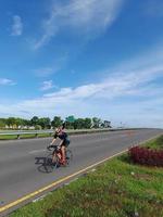 Lombok Island, Indonesia, October 8, 2022, One of the cyclists participating in the Ironman 70.3 triathlon on the island of Lombok, Indonesia photo