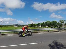 Lombok Island, Indonesia, October 8, 2022, One of the cyclists participating in the Ironman 70.3 triathlon on the island of Lombok, Indonesia photo