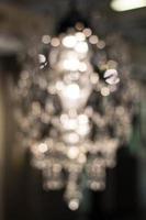 Texture, background. light crystal chandelier with blurred focus photo