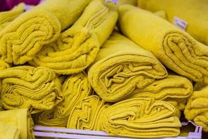 pile of yellow towel arranging in layer photo