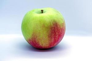 Red-green apple on a white background photo