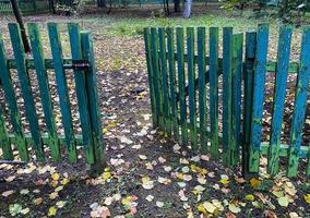 Wooden fence with a gate photo