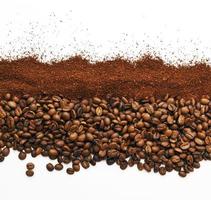 Coffee beans and ground coffee on a white background. The photo shows coffee grains and ground coffee on a white background, photo for the background.