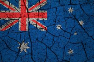 Dry soil pattern on the flag of Australia. Country with drought concept. Water problem. Dry cracked earth country. photo