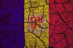 Dry soil pattern on the flag of Andorra. Country with drought concept. Water problem. Dry cracked earth country. photo