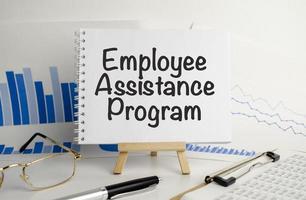 EAP Employee Assistance Program on notepad and charts photo