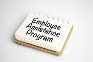 word EAP Employee Assistance Program text on white paper on light background photo