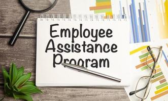 notepad ,chart and calculator. Top view text EAP Employee Assistance Program photo