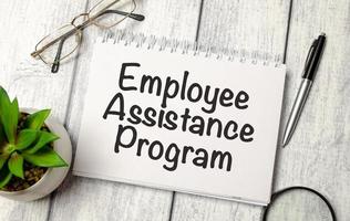 notepad ,chart and calculator. Top view text EAP Employee Assistance Program photo