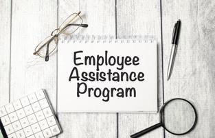 notepad ,chart and calculator. Top view text EAP Employee Assistance Program photo