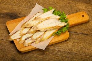 Eel sashimi on wooden board and wooden background photo