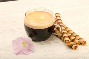 Espresso coffee on wooden background photo