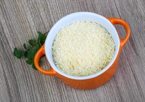 Shredded parmesan on wood photo