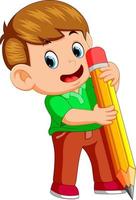 a young boy holding big pencil vector