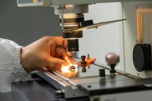 A closeup of the production and quality control of the internal parts of medical syringes photo