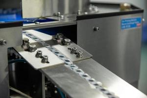 A closeup of the production of medical syringes photo