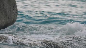 Turquoise waves rolled on the rocks, beach of Koh Miang island, Similan Islands, slow motion video