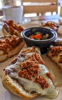 Mexican breakfast bread roll with chorizos in Oaxaca Mexico. photo