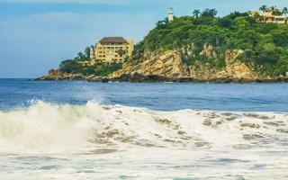 Extremely huge big surfer waves at beach Puerto Escondido Mexico. photo