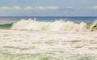 Extremely huge big surfer waves at beach Puerto Escondido Mexico. photo