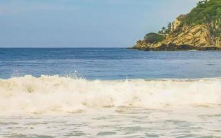 Extremely huge big surfer waves at beach Puerto Escondido Mexico. photo