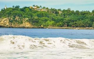 Extremely huge big surfer waves at beach Puerto Escondido Mexico. photo