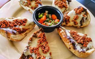 Mexican breakfast bread roll with chorizos in Oaxaca Mexico. photo